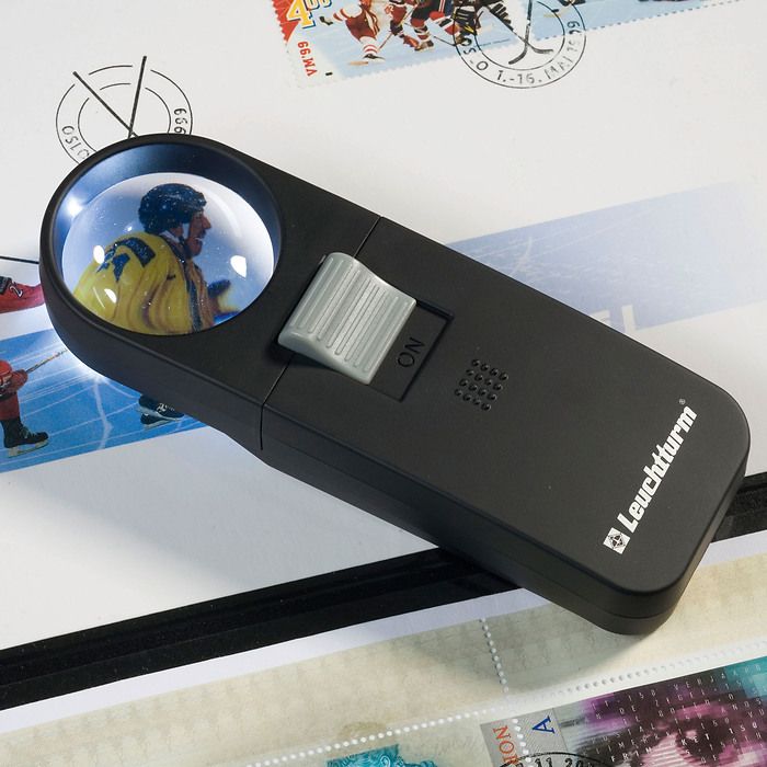 Hand held 7x magnifier with LED